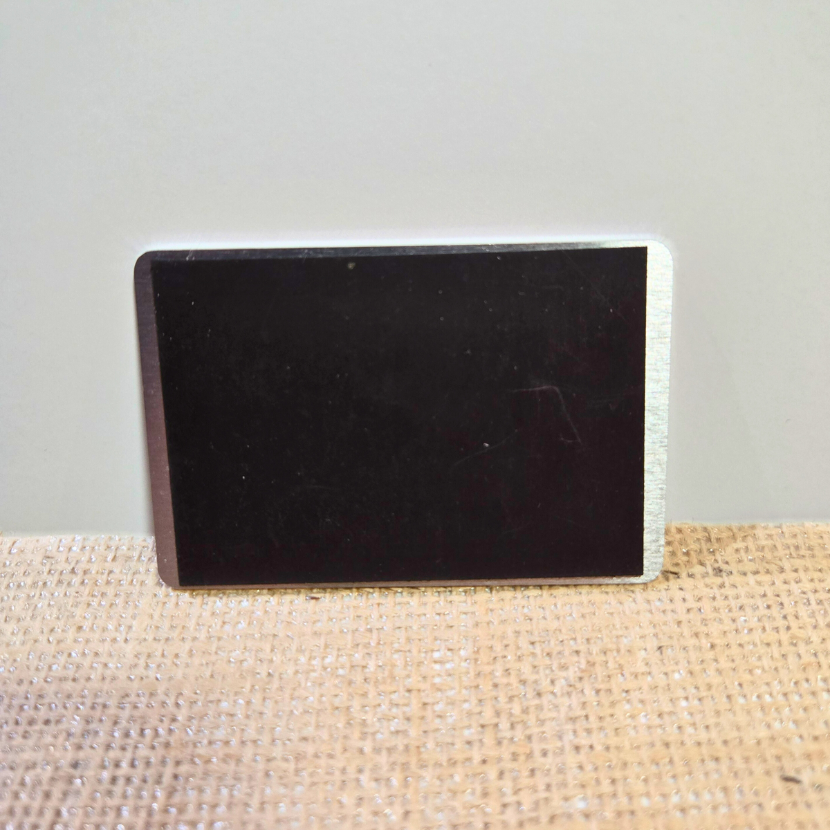 strong magnet for a 2x3in metal business card perfect for any magnetic surface.