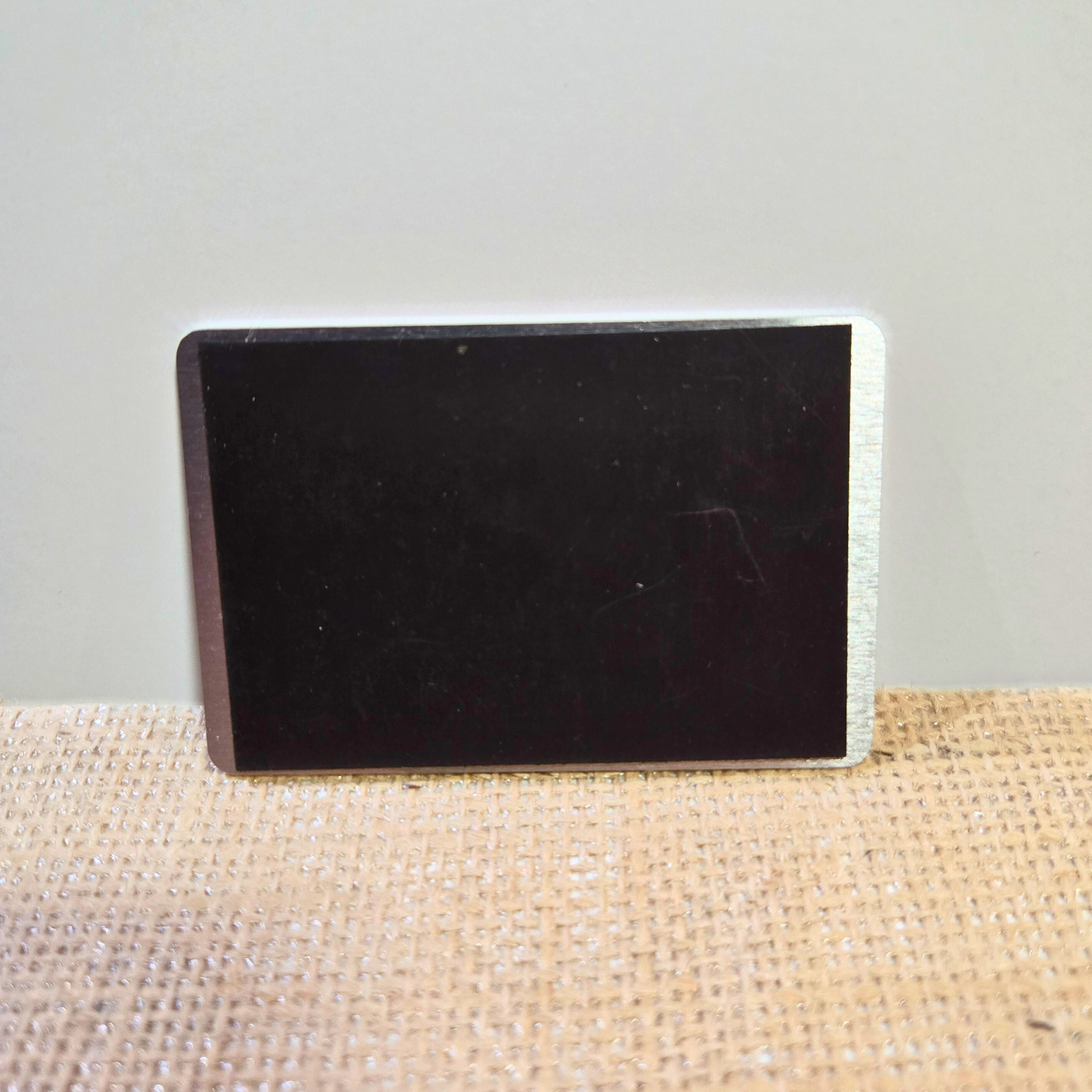 strong magnet for a 2x3in metal business card perfect for any magnetic surface.